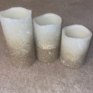 Battery operated lit candles. Home decor. White and gold sparkle.